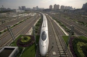 a bullet train pulls into beijing south railway station july 300x199 Solar Powered Train Stations On Track In China